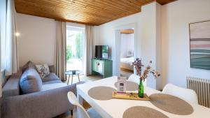 a living room with a couch and a table at Ferienpark Scheiber in Unterburg am Klopeiner See