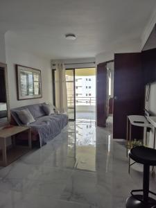 a bedroom with a bed and a table and a television at Magia en AltaMar in Cartagena de Indias +20 photos