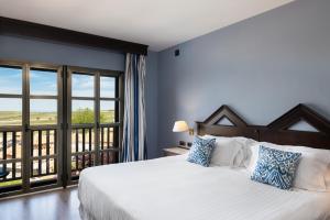 Ένα ή περισσότερα κρεβάτια σε δωμάτιο στο RL Ciudad de Úbeda