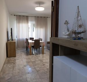 a kitchen and dining room with a table and chairs at CasaVacanzeRoseto in Roseto degli Abruzzi
