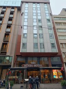 a group of people standing in front of a building at Mineo Hotel Taksim in Istanbul