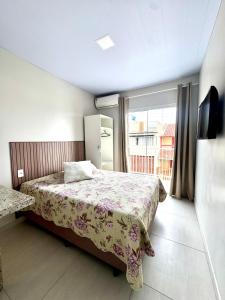 Postel nebo postele na pokoji v ubytování Pousada Massiambu