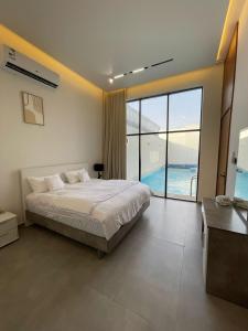 Postel nebo postele na pokoji v ubytování فلفت- شاليه