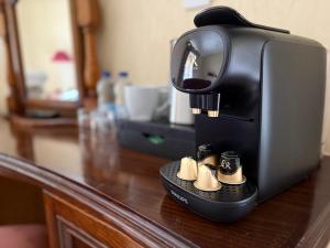 a coffee maker sitting on top of a counter at Tanronnen Inn in Beddgelert