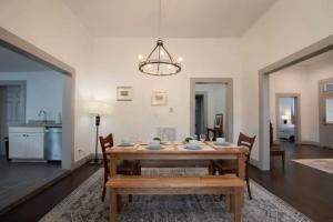 a dining room with a wooden table and chairs at Division Ave East Lake Update in Irondale