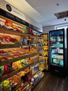 a grocery store aisle with a refrigerator in a store at Get a Flat 405 Noble-Jardins Neighborhood - SP in Sao Paulo +37 photos