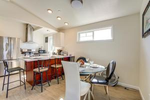 a kitchen with a table and chairs in a kitchen at Walk to Dimond District Gems Home in Oakland in Oakland