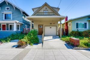a house with a garage in a row of houses at Walk to Dimond District Gems Home in Oakland in Oakland