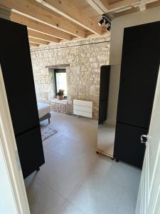an open door to a room with a bedroom at La Ruche Enchantée in Champigny-sur-Veude