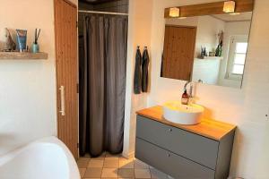 a bathroom with a sink and a toilet and a shower at 10732-Ulfborg-Svollingvej-94 in Ulfborg +20 photos