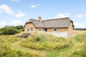 an old house on a hill in a field at 10732-Ulfborg-Svollingvej-94 in Ulfborg
