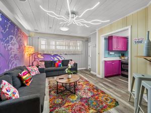 a living room with a couch and a table at Spacious Unique Heated Pool 2 Hot Tubs Pkg in Sarasota