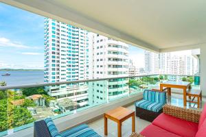 a balcony with a view of a large building at |Ahead| Lindo 2BR @Castillogrande cerca a la playa in Cartagena de Indias