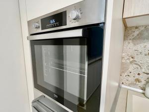 a stainless steel oven in a kitchen at Douloudis Luxury Apartment in Alexandroupoli