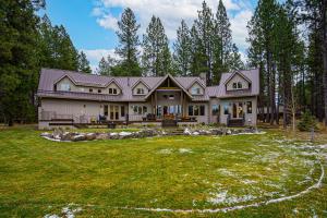 a house with a large yard in front of it at Meadowview Haven in Black Butte Ranch