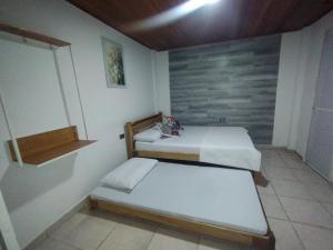 Ένα ή περισσότερα κρεβάτια σε δωμάτιο στο Hostal casa alta