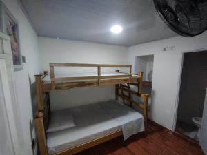 Ένα ή περισσότερα κρεβάτια σε δωμάτιο στο Hostal casa alta