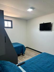 Μια τηλεόραση ή/και κέντρο ψυχαγωγίας στο Aloha-Te Tierra Amarilla