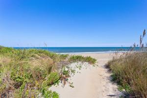 a sandy beach with the ocean in the background at 5237 - Carpe Dune in Croatan Shores