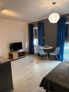 TV a/nebo společenská místnost v ubytování Apartament Oslo