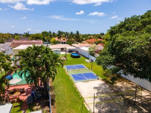 an aerial view of a tennis court in a yard at 5BR Game Retreat Pool, Mini Golf and Firepit L86 