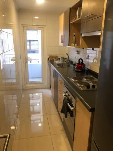 a kitchen with a sink and a counter top at Lagos Temuco in Temuco