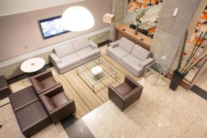 Area lounge atau bar di Hotel Continental Business - 200 metros do Complexo Hospitalar Santa Casa