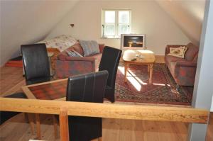 a living room with a couch and a table at 10850-Ulfborg-Vester-Mosevej-82 in Øby