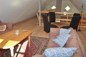 a living room with a couch and a table at 10850-Ulfborg-Vester-Mosevej-82 in Øby