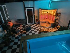 a view of a living room with a swimming pool at White Party House in Veľké Kosihy