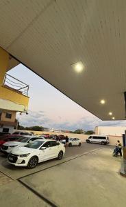 a group of cars parked in a parking lot at Pousada Amorim in Frecheirinha +4 photos