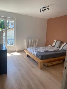 Ένα ή περισσότερα κρεβάτια σε δωμάτιο στο Appartement