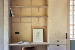 a room with a book shelf and a picture at Sauseriai - Inspired by Nature S2 in Prystovai
