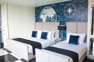 Ein Bett oder Betten in einem Zimmer der Unterkunft Mera Mare Pattaya