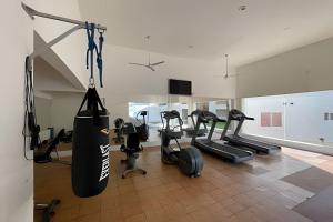 a gym with a punching bag in a room at Villa Dorada in Cabo San Lucas