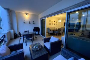 a living room with a couch and a table at Puerta Cabos Village in Cabo San Lucas