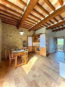 a large living room with a wooden ceiling at Torre della Soara - Medieval Tower in the Umbrian Countryside in Città di Castello
