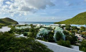 an aerial view of a resort with the ocean at GypSea in Anse Marcel 