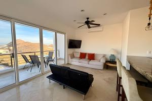 a living room with a couch and a table with chairs at Vista Colorada in El Bedito