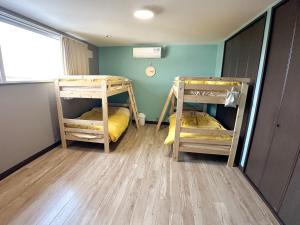 two bunk beds in a room with a window at Matsune - Vacation STAY 12969v in Noboribetsu