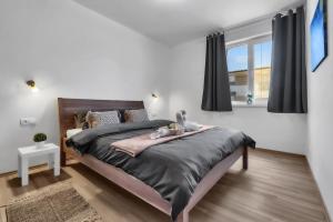 Postel nebo postele na pokoji v ubytování BNB Stupava Apartment with Garden and Parking
