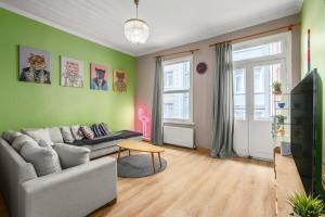 a living room with a couch and a tv at Cozy Private House in Kadikoy in Istanbul