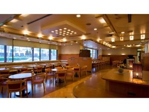 a dining room with tables and chairs in a restaurant at Smile Hotel Tokushima - Vacation STAY 10507v in Tokushima