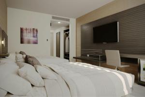 Postel nebo postele na pokoji v ubytování AC Hotel by Marriott Georgetown Guyana + 72 fotografií