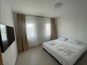 Ένα ή περισσότερα κρεβάτια σε δωμάτιο στο Chic Studio in Central Bodrum – Walk to Marina
