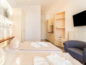 Televisyen dan/atau pusat hiburan di Unvergessliches Apartment am See
