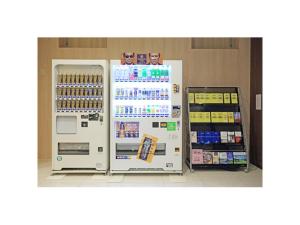 a refrigerator in a store next to a shelf at Smile Hotel Hakata Ekimae - Vacation STAY 64014v in Fukuoka