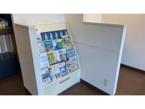 a refrigerator filled with lots of books at Smile Hotel Sendai Tagajyo - Vacation STAY 05425v in Tagajo +14 photos