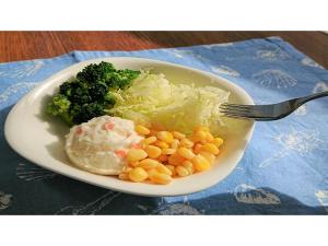 a plate of food with broccoli and corn and a fork at Smile Hotel Kobe Motomachi - Vacation STAY 05041v in Kobe +30 photos