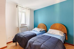 En eller flere senge i et værelse på La Casa Del Sole